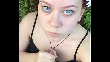 Redhead slut gives a nasty blowjob deep in the forest